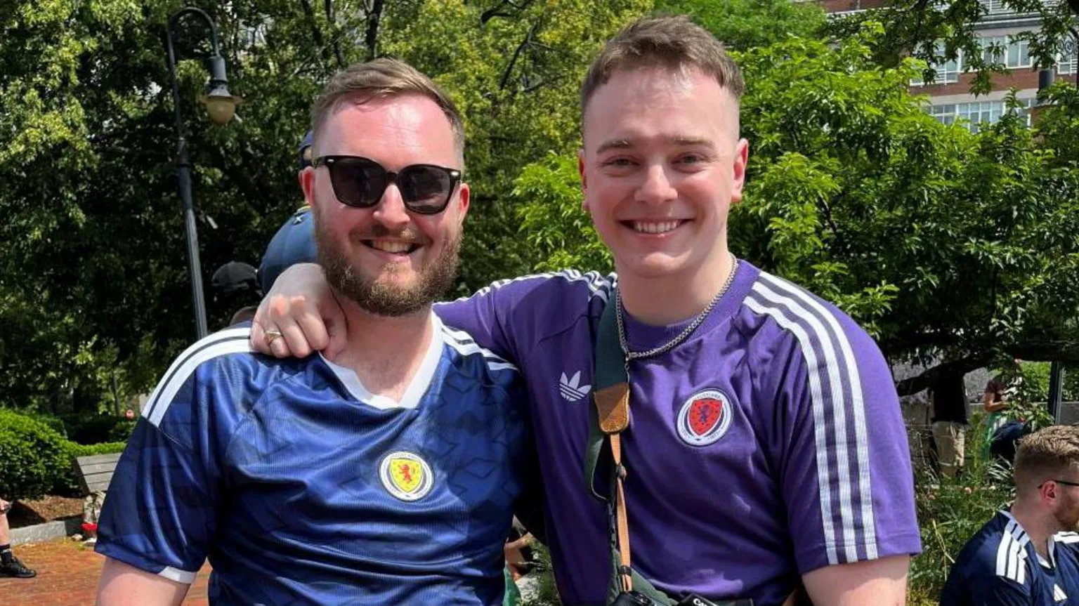 Two men wearing Scotland strips.