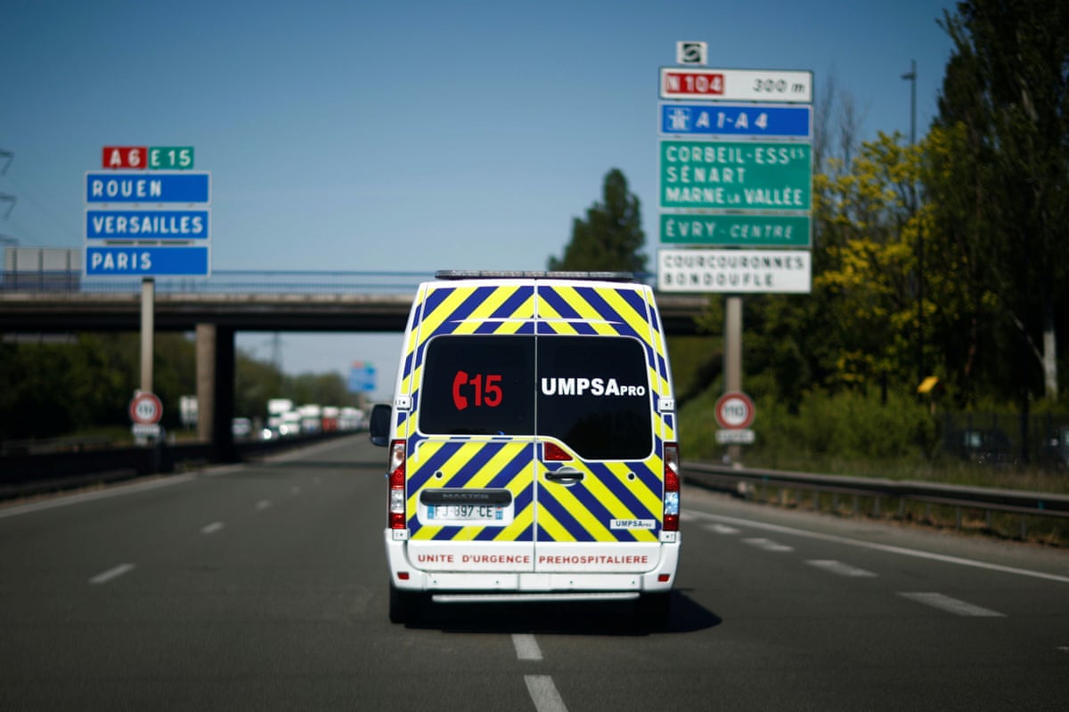 An ambulance transports a man suspected of being infected with coronavirus at the Sud Francilien hospital in Corbeil-Essonne near Paris