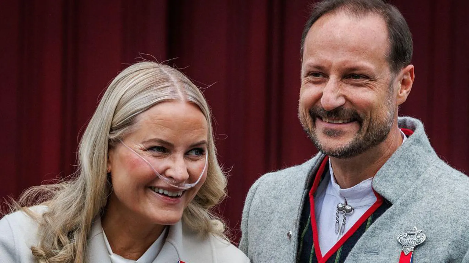 Crown Princess Mette Marit of Norway (L) and Crown Prince Haakon of Norway attend the Norwegian Constitution Day with the children's parade at their residence Skaugum on May 17, 2026