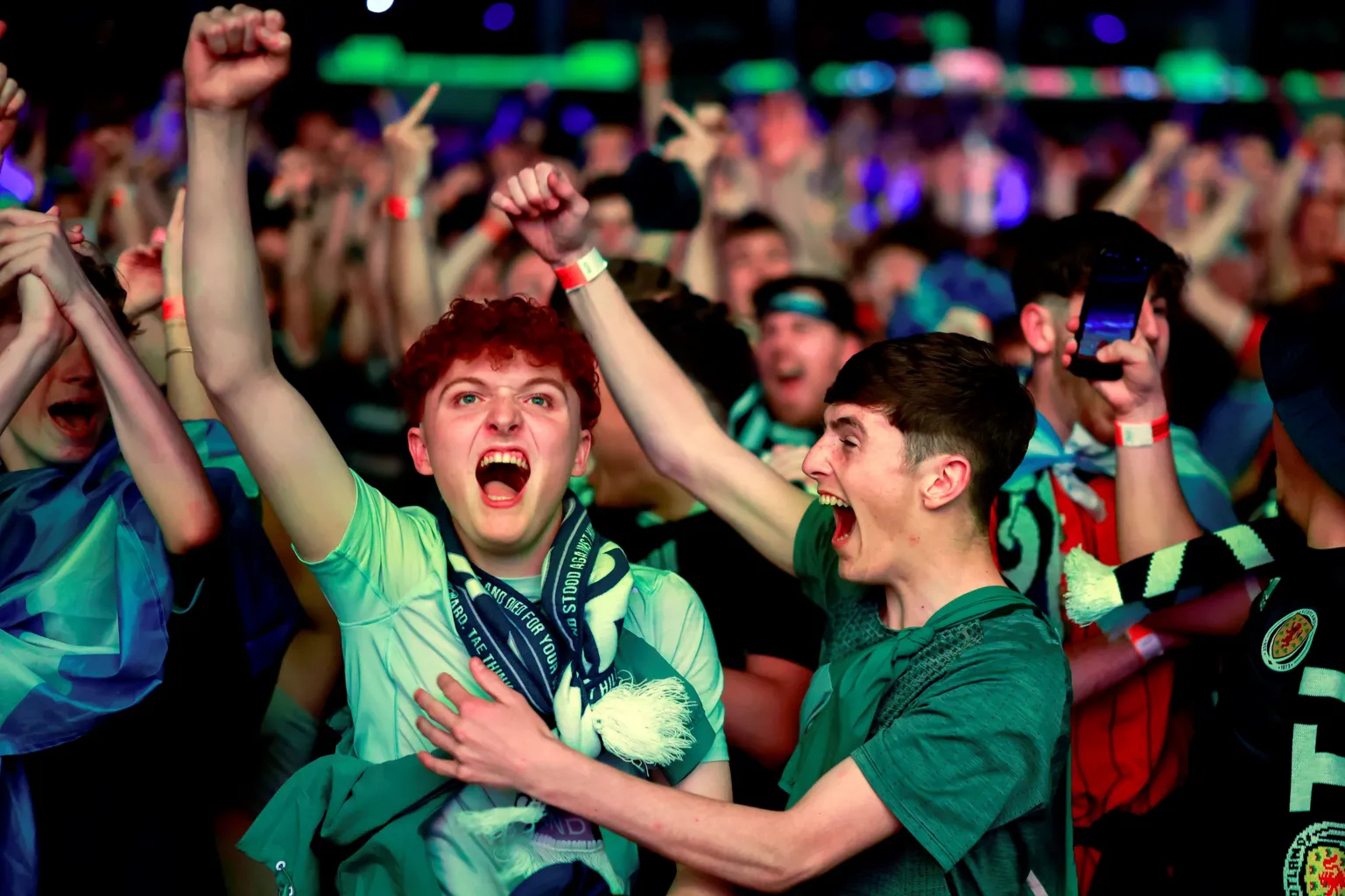 Fans celebrate at the OVO Hydron in Glasgow.