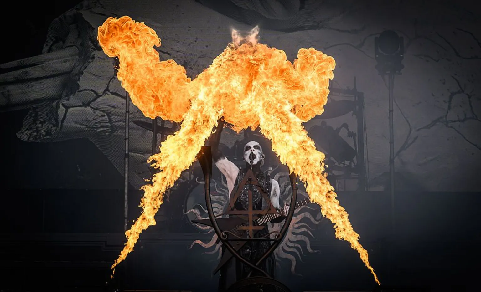  Behemoth performing with flames shooting into the air