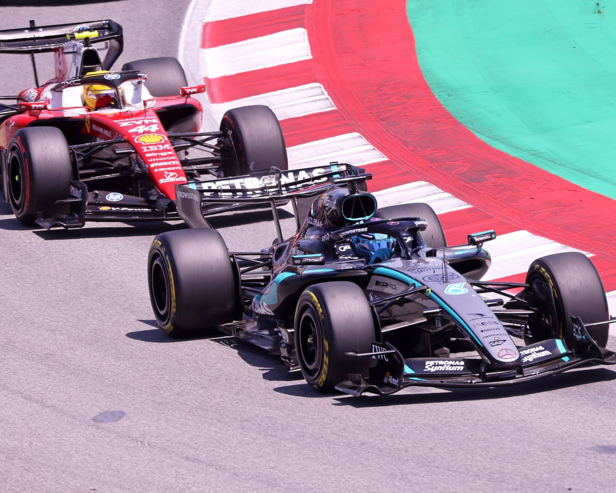 Lewis Hamilton chases George Russell, who was in control early in the race