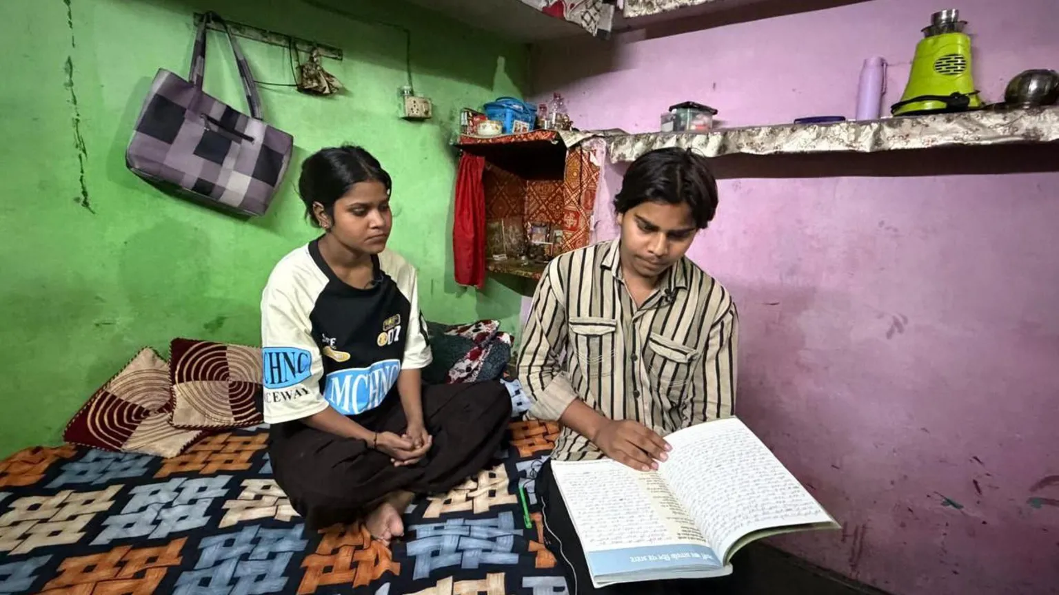 Siblings Kajal and Abhishek in their home in Sundar Nagri