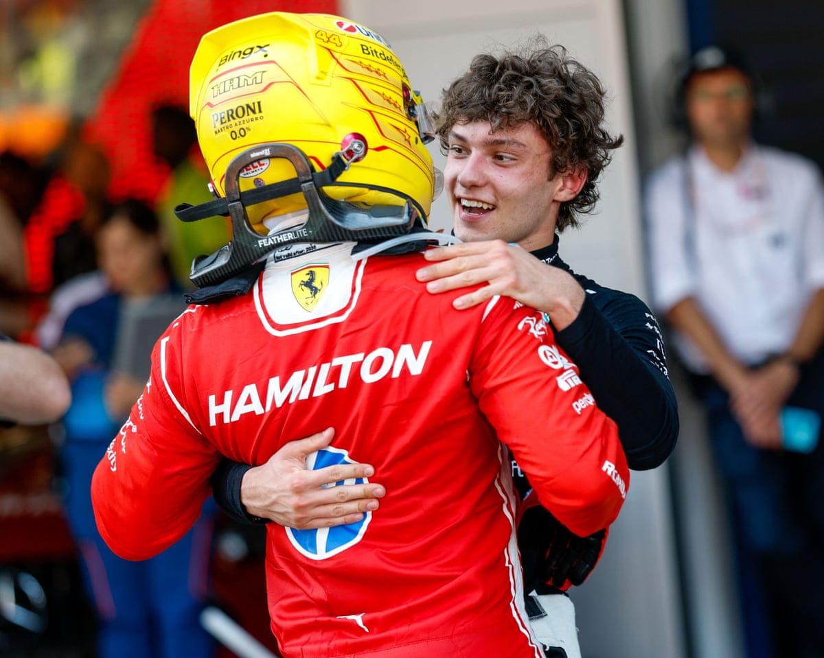 Kimi Antonelli of Mercedes hugs Lewis Hamilton of Ferarri after the latter wins the Barcelona GP