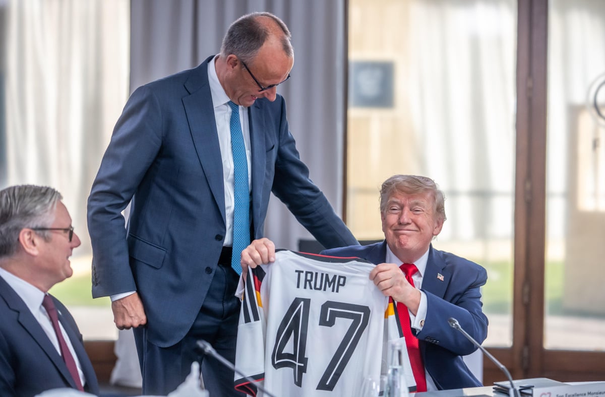 Keir Starmer (left) as Friedrich Merz presents a Germany football top to Donald Trump, who is the 47th US president (and was the 45th)