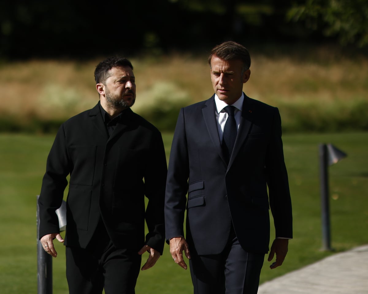 French president Emmanuel Macron, right, walks with Ukrainian president Volodymyr Zelenskyy at the Hotel Royal for the G7 Summit in Evian-les-Bains, France.