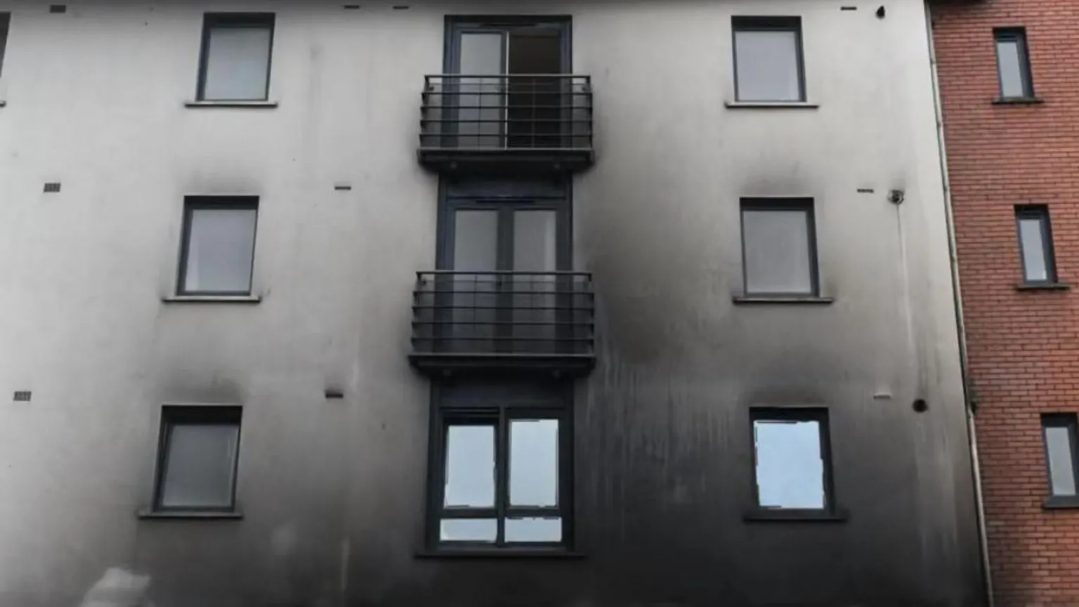 Tejal Samat and Nishath Mohammed A building showing smoke damage to the outside.