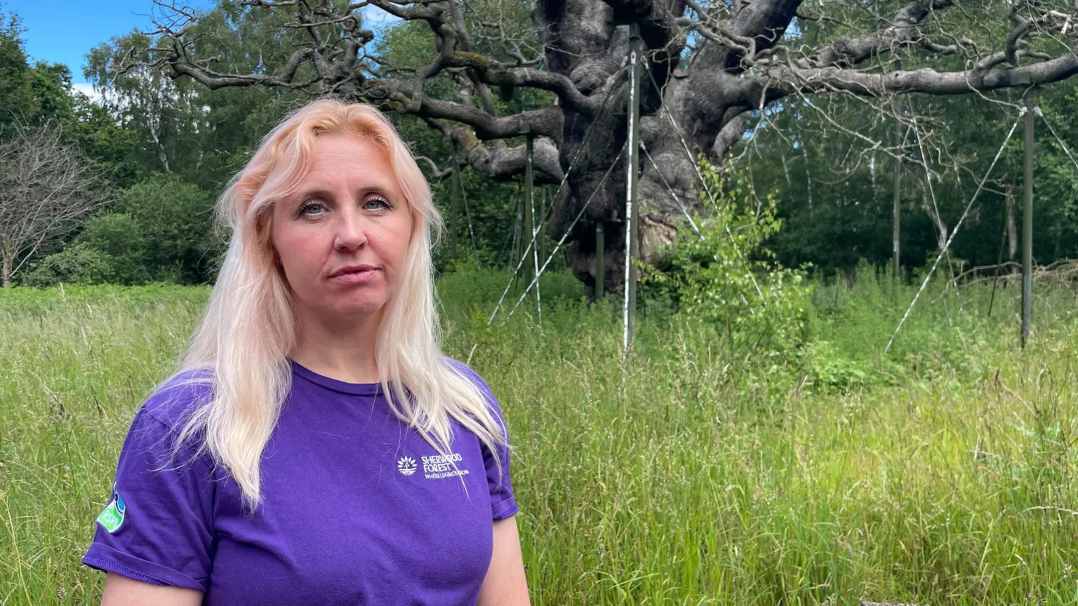 Chloe from the RSPB in front of the tree