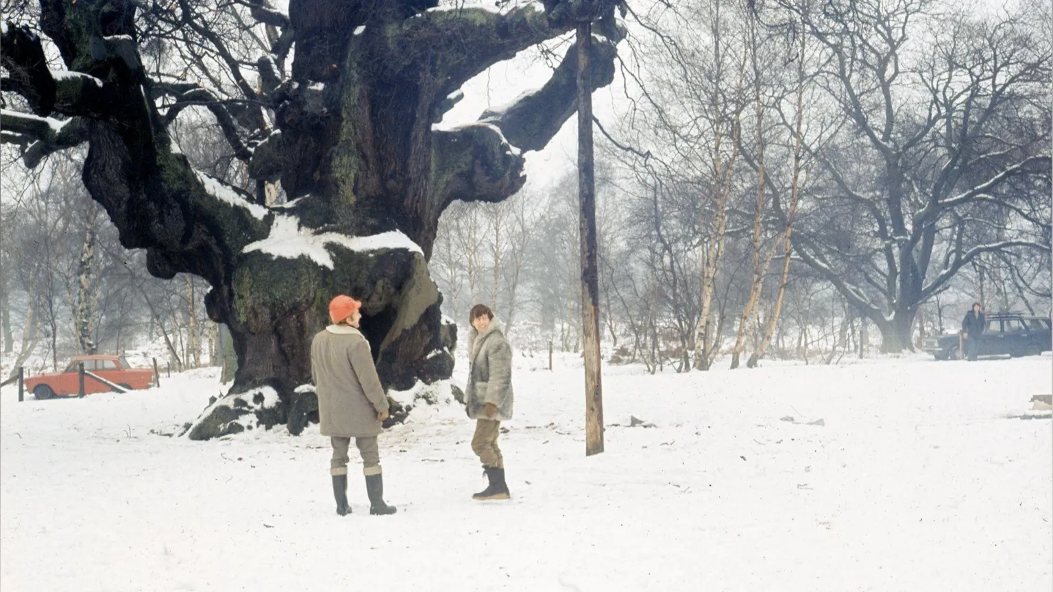 Blue Peter presenter John Noakes in Sherwood Forest in 1972 standing in front of the Major Oak which is surrounded by snow