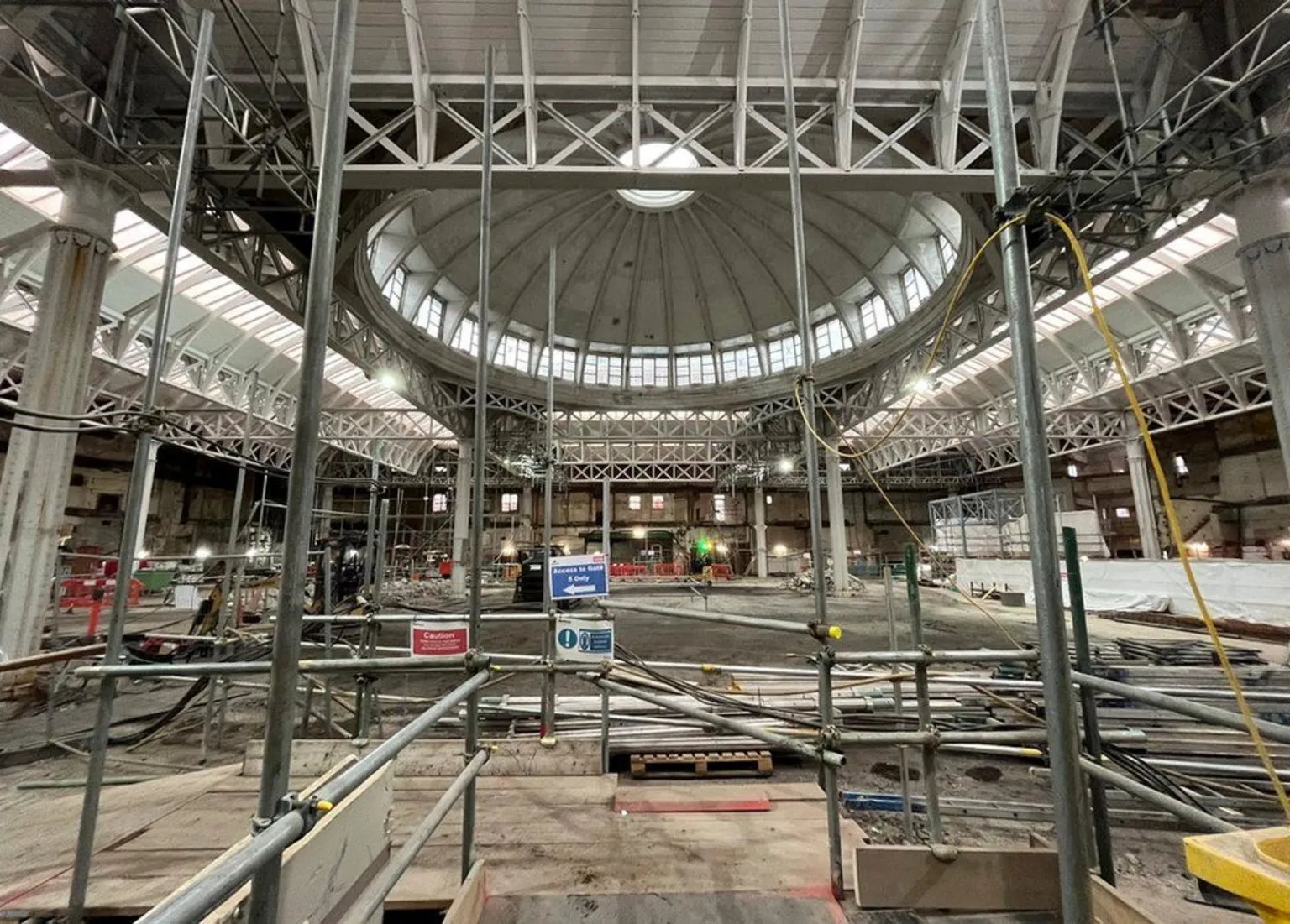 Scaffolding and a building site inside the General Market hall of Smithfield Market with the giant dome seen at the centre of the ceiling