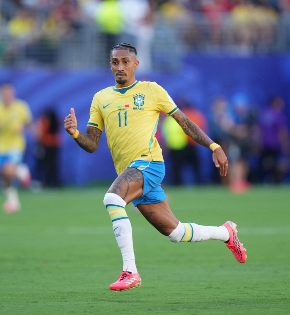 Raphinha running in a Brazil game