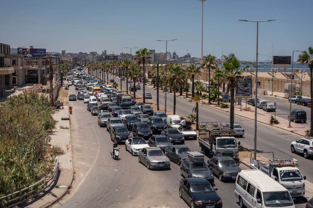 A column of cars heading in one direction on a major road.
