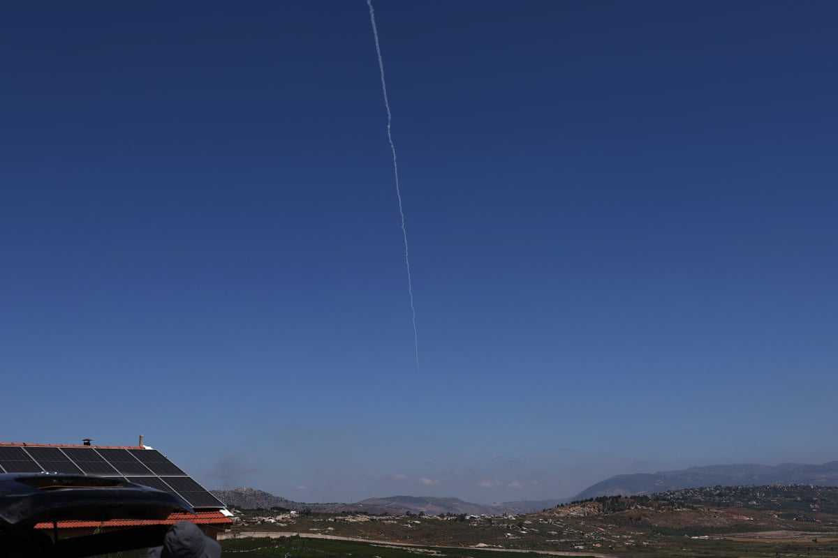 A white line in a clear sky from a projectile being intercepted.