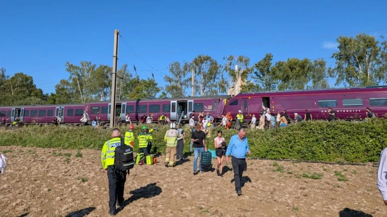 Alex Knight People leaving train following Bedford train crash