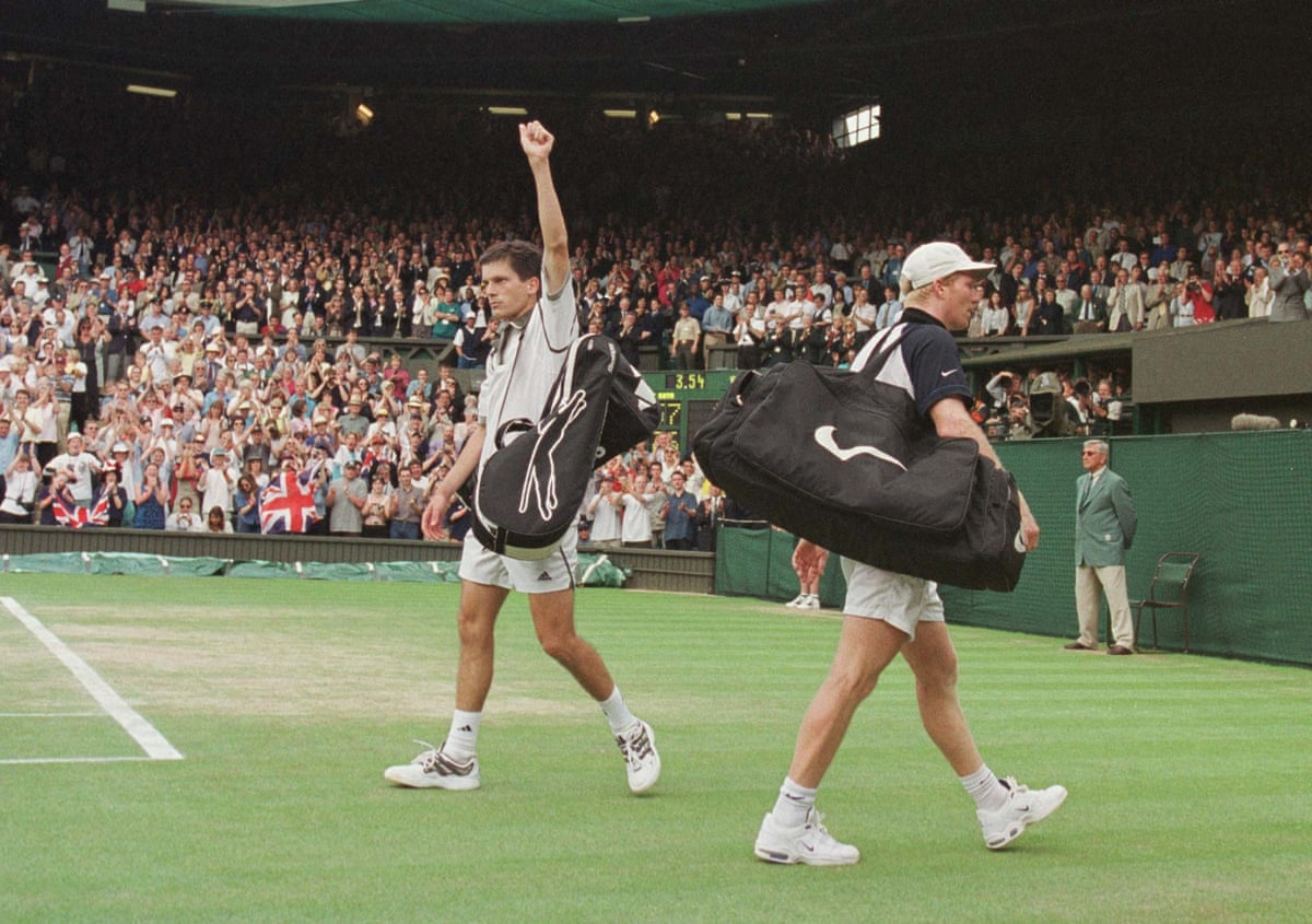 Tim Henman raises his fist in the air after beating James Courier in the fourth round of Wimbledon in 1999