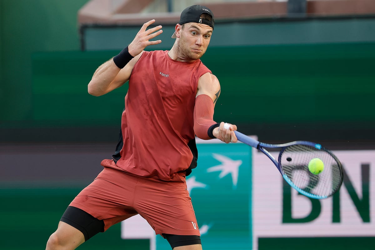 Jack Draper returns the ball during his quarter-final against Daniil Medvedev at Indian Wells