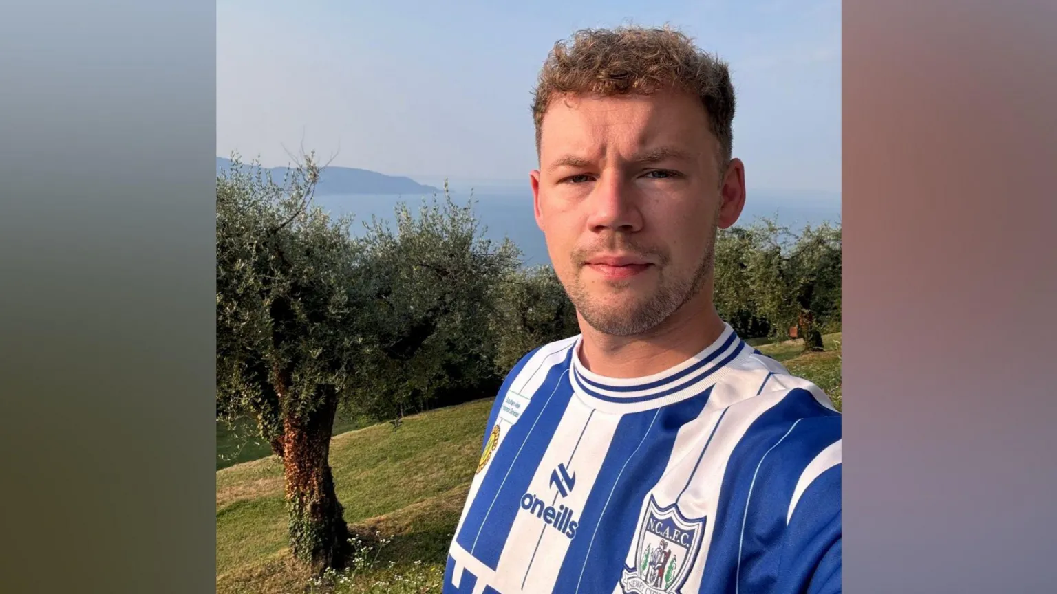 Richard Kehoe A man with fair hair looking at the camera, he is wearing a blue and white striped Newry top