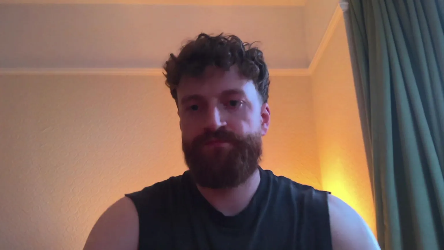 A man in a black vest