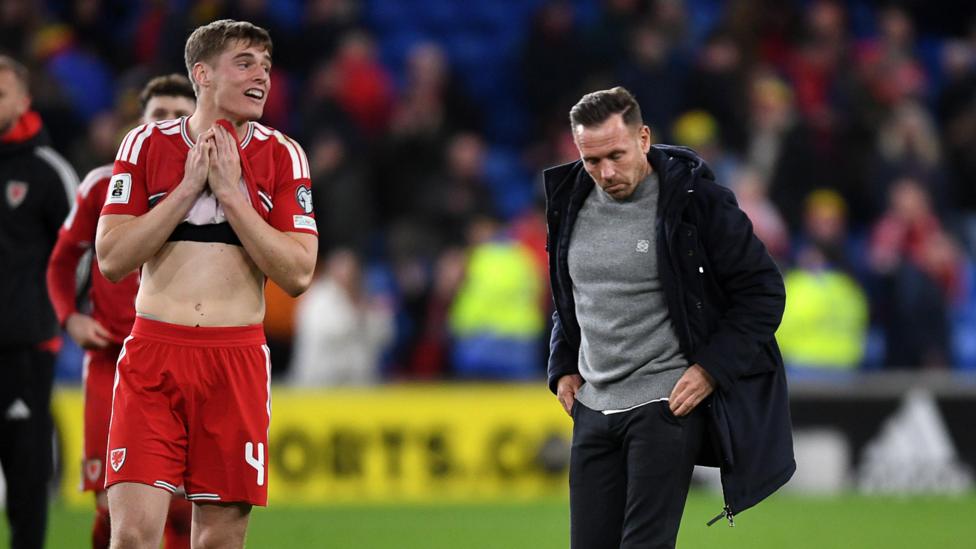 Dejected Dylan Lawlor and Craig Bellamy