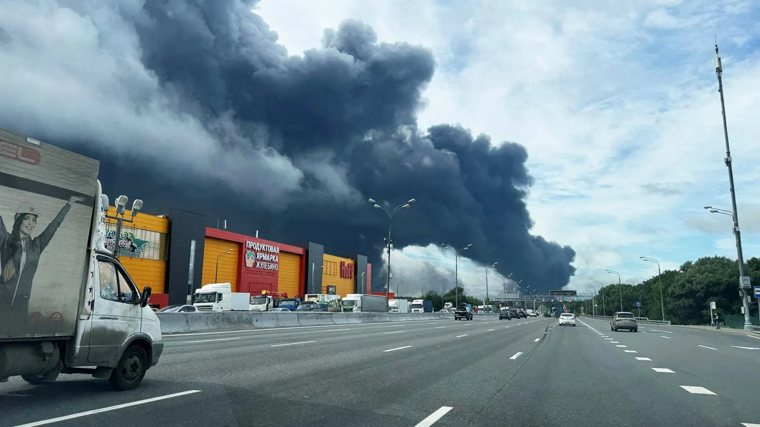 Black smoke billows over the Moscow ringroad from a fire at a Moscow oil refinery
