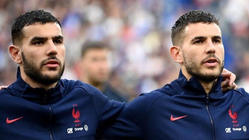Brothers Lucas (right) and Theo Hernandez sing the national anthem before France face Demark in 2022