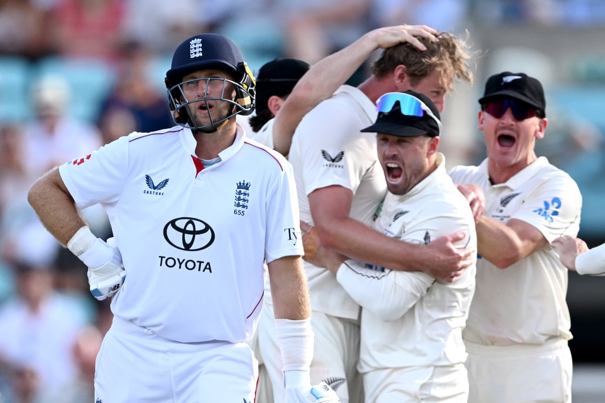 England’s Joe Root watches the big screen as New Zealand celebrate the dismissal of James Rew.