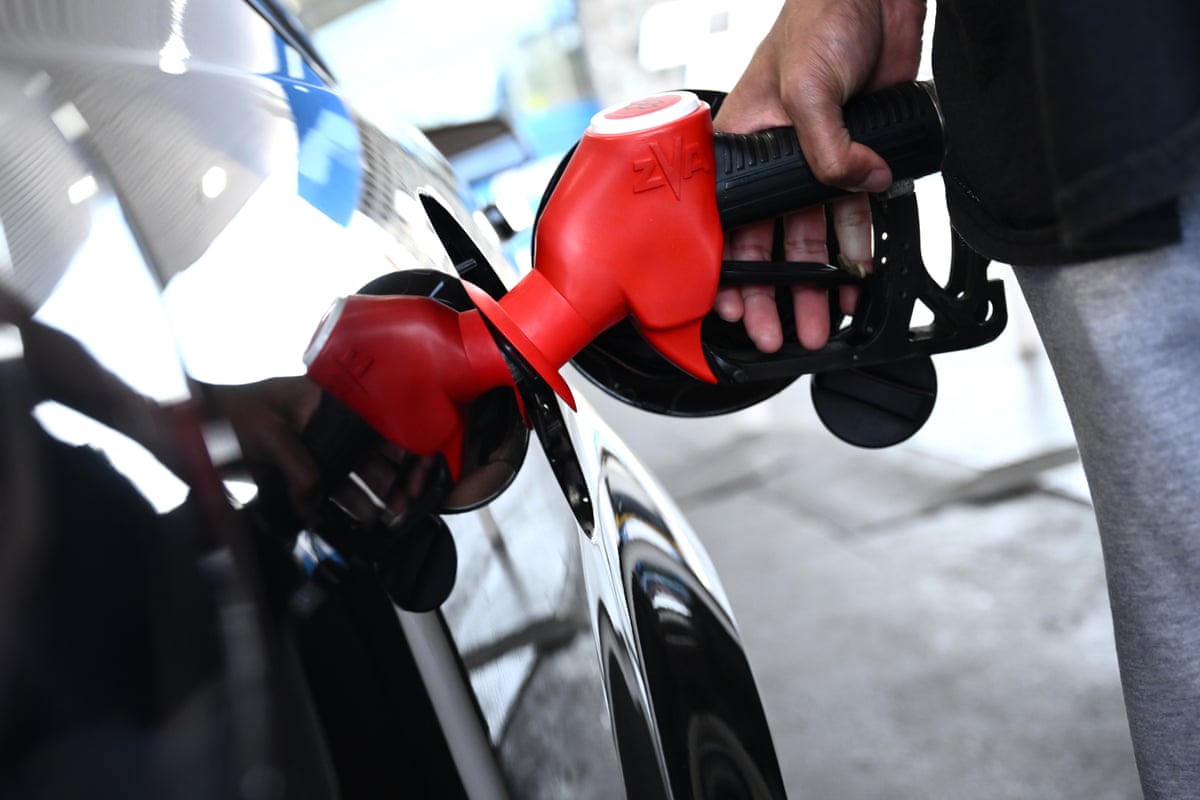 Person filling up at petrol pump