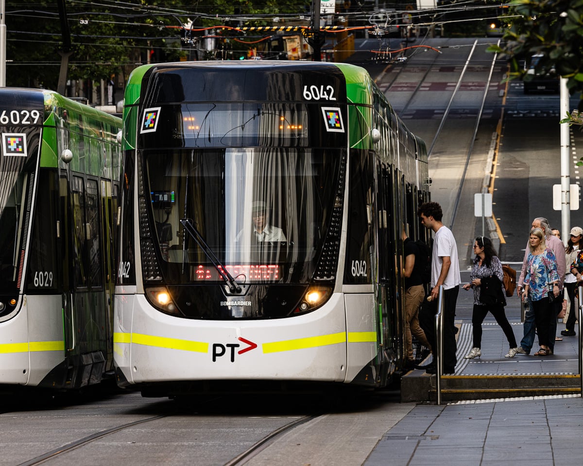 Commuters in Melbourne board a tram