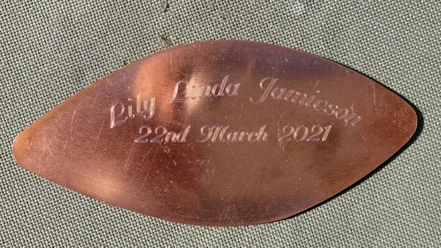 Eilidh Jamieson A brass leaf inscribed with the words Lily Linda Jamieson 22nd March 2021