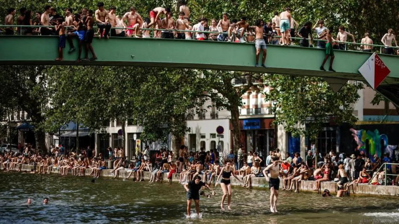 EPA people jump into a Paris canal to cool off