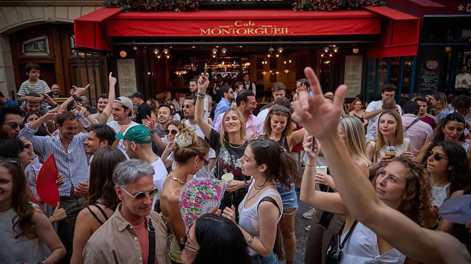  Revellers dance in the street during Fete De La Musique 2025 as bands and DJs play on streets across the French capital.