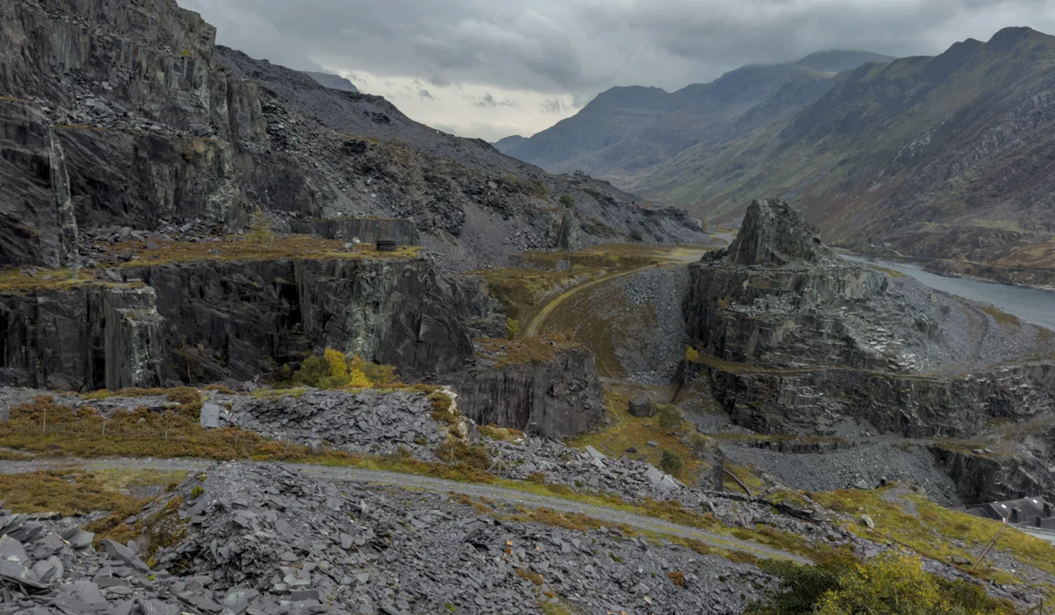  Dramatic grey slate landscape of a sprawling old mine set within the mountains of Eryri