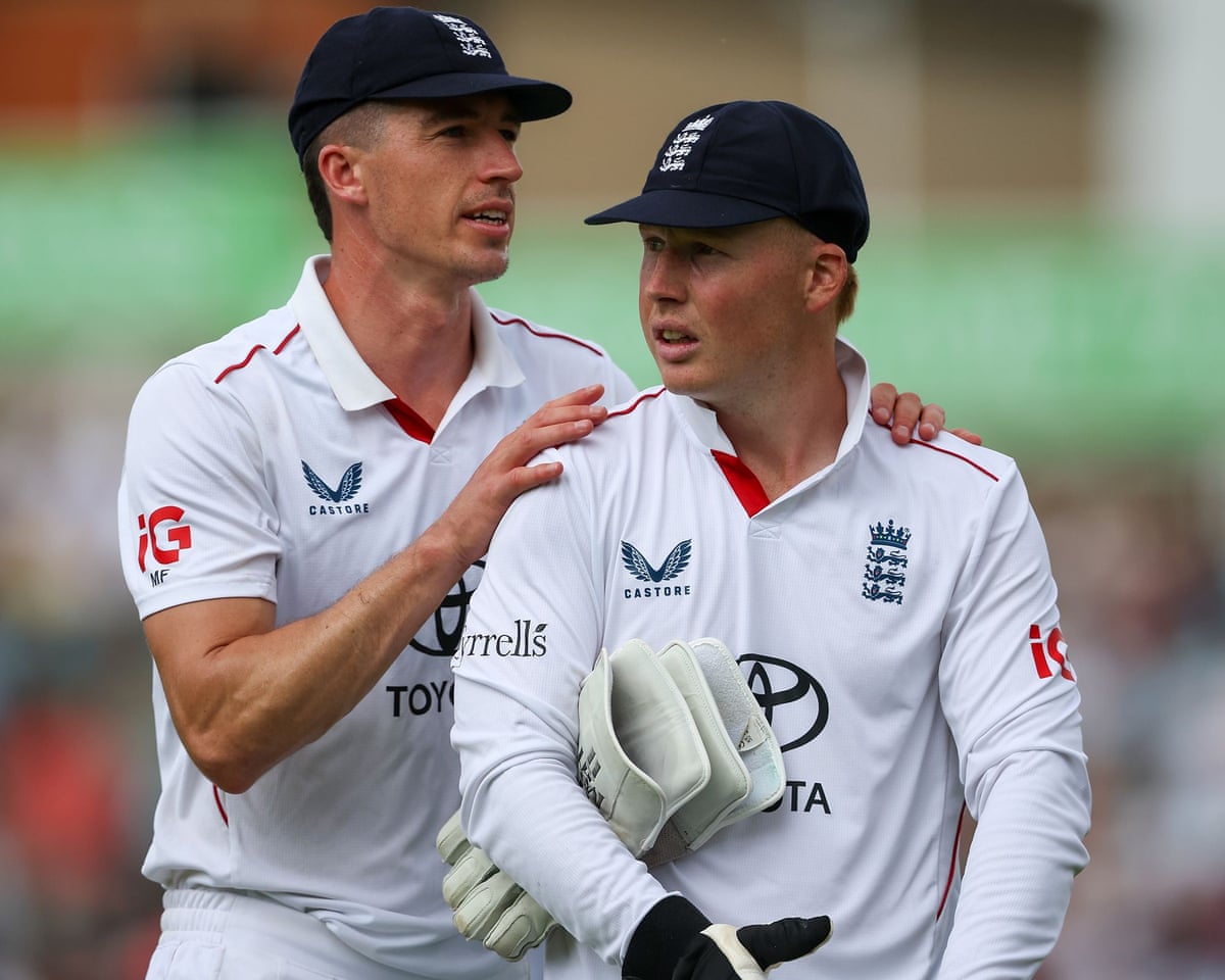 England debutant James Rew receives encouragement from fast bowler Matt Fisher
