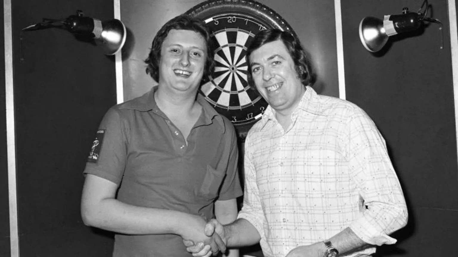  A black and white picture of darts legends Eric Bristow and John Lowe