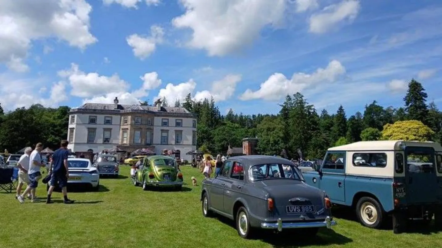 BBC Weather Watcher John Vehicles parked in front of a large house, on the lawn at Montalto estate in County Down.