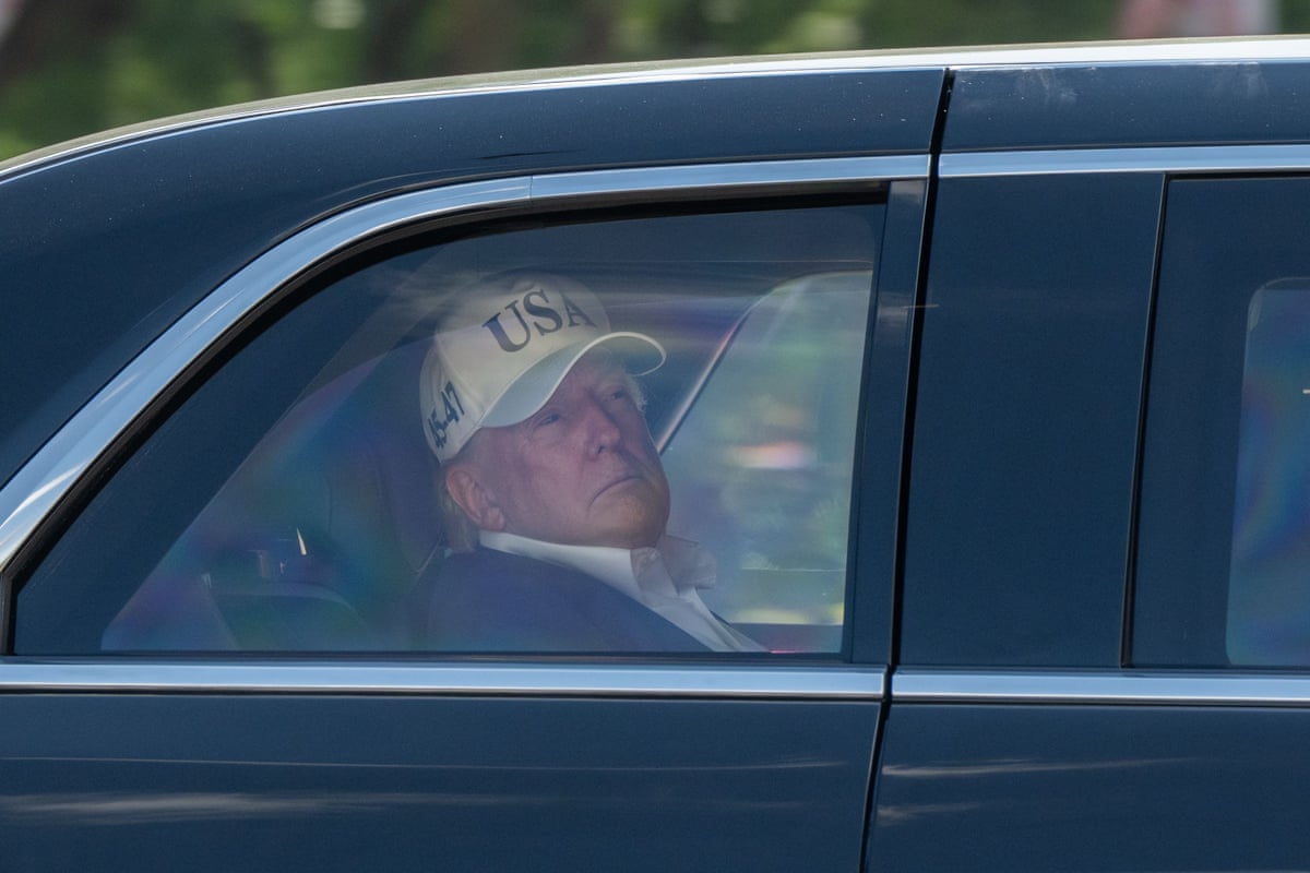 Donald Trump in the back of a car