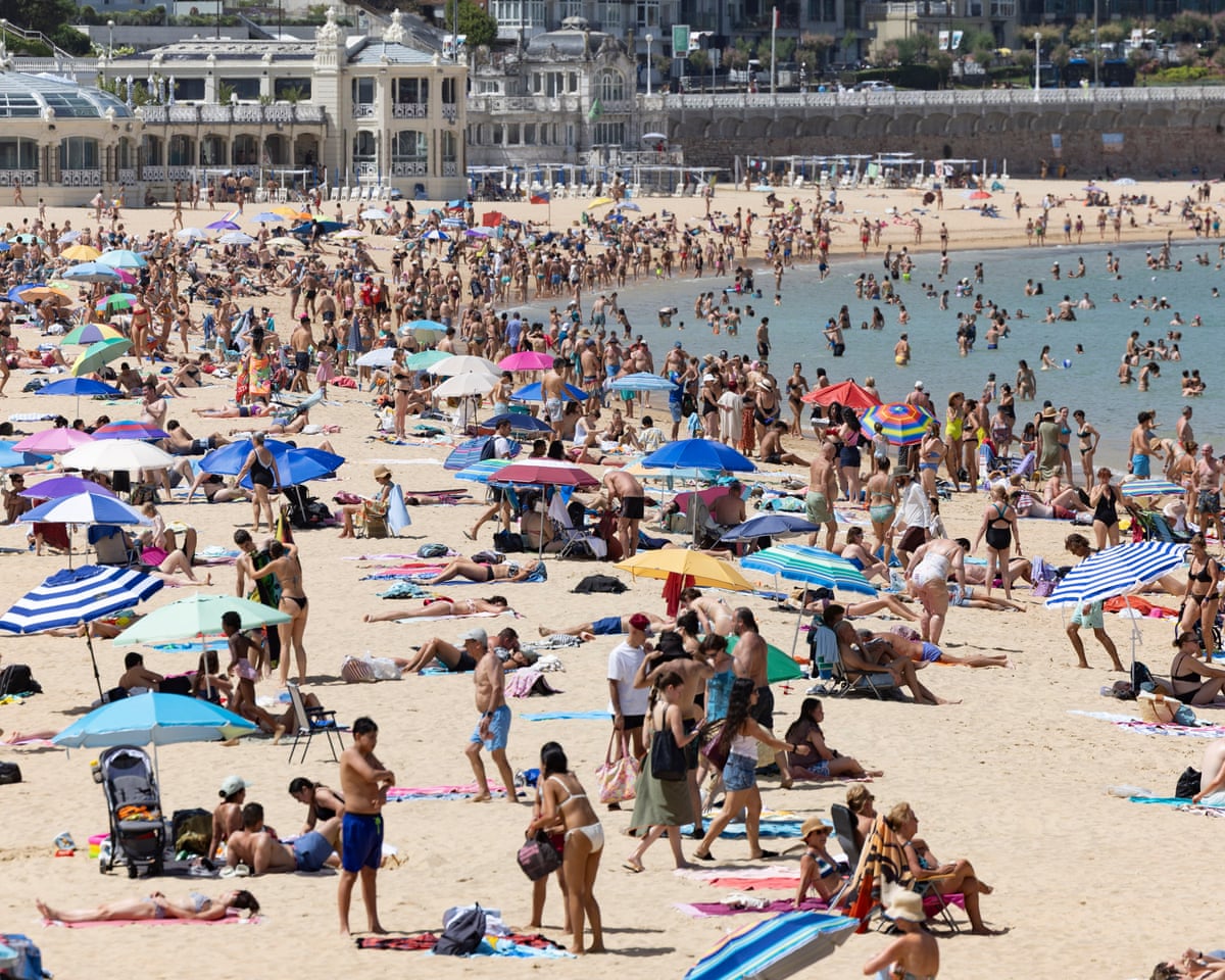People crowd at La Concha Beach in San Sebastian, Spain. The country has had daytime highs of up to 42C and sweltering nights