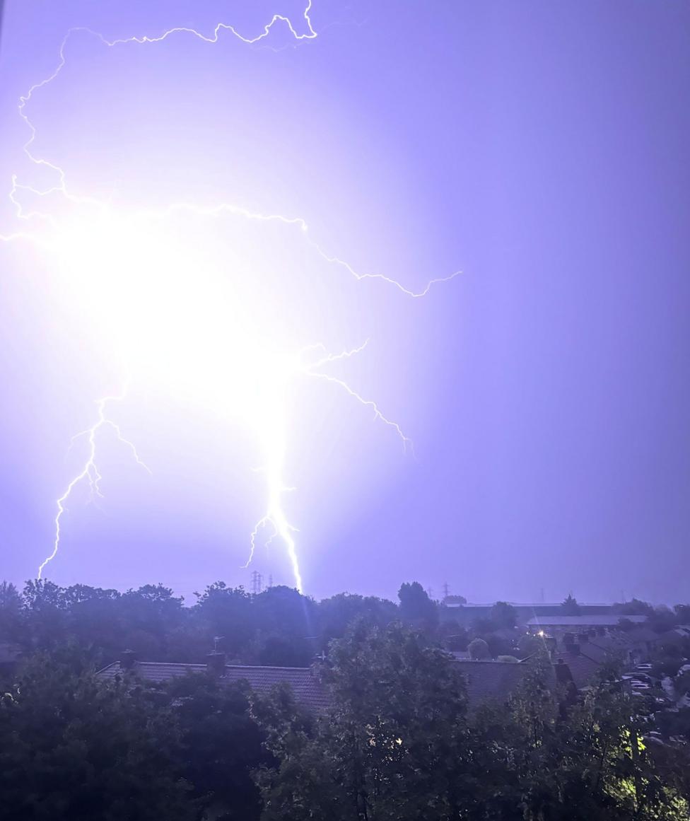 Lightning lights up the sky in Waltham Cross, Hertfordshire