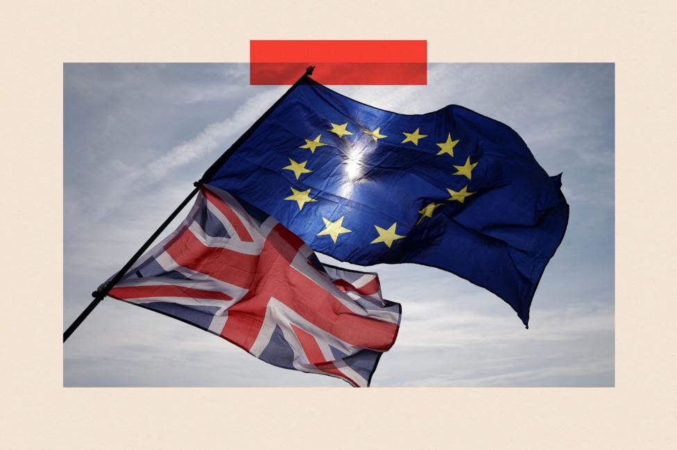 Two flags flying next to one another - the union jack and the EU flag