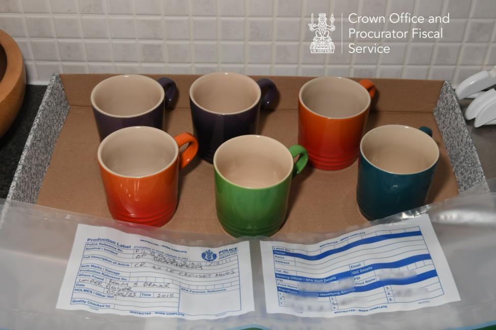 Le Creuset mugs on the kitchen counter. They are different colours.