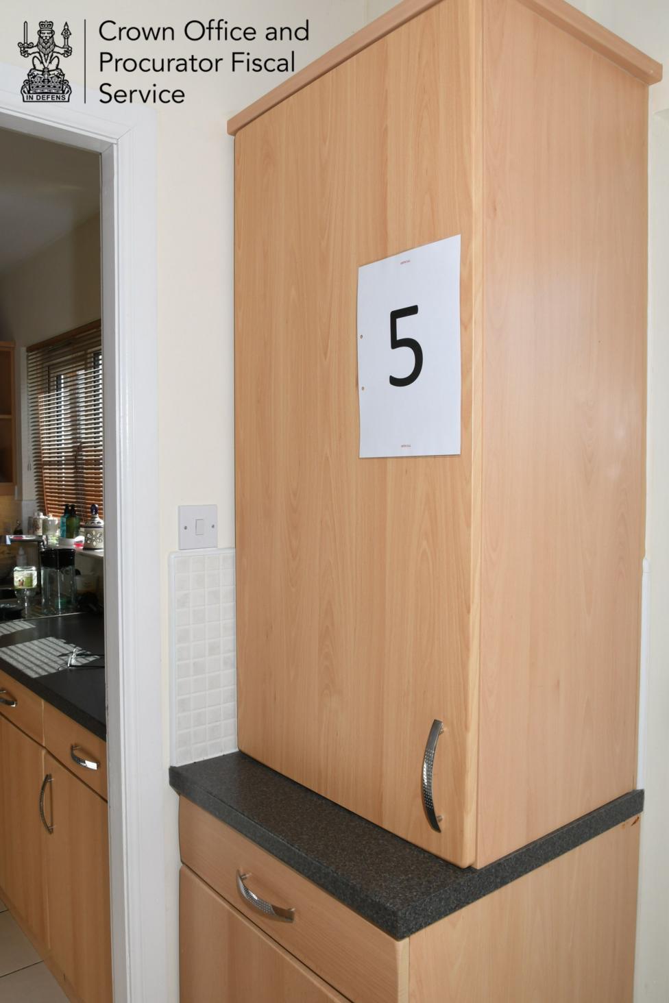 A wooden boiler cabinet.