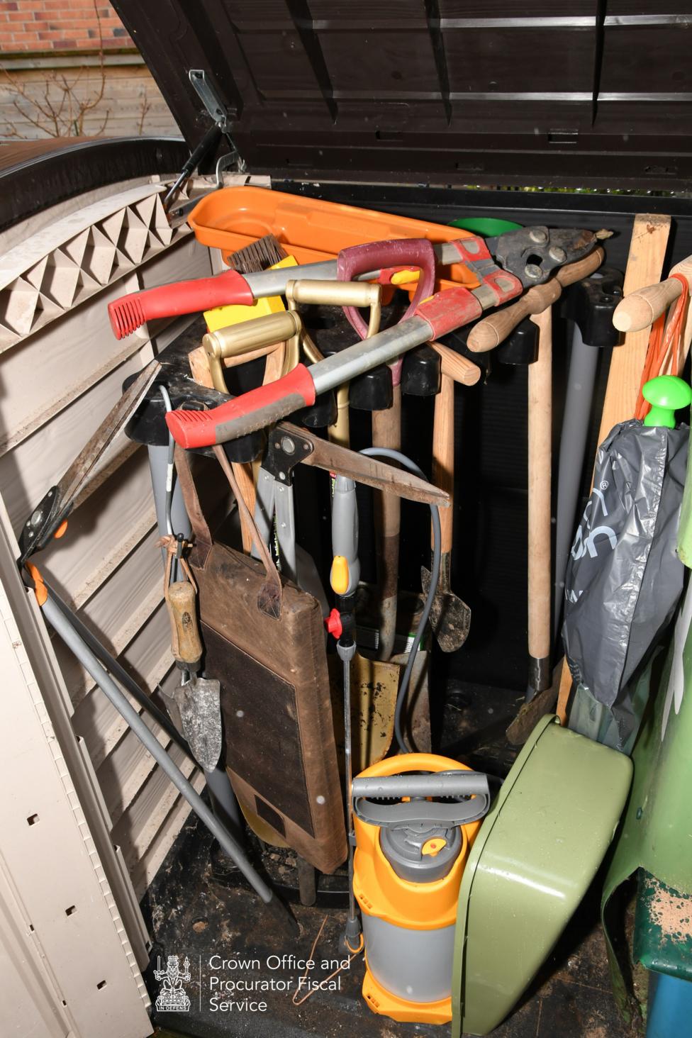 Crown Office photograph of garden tools in a storage box.