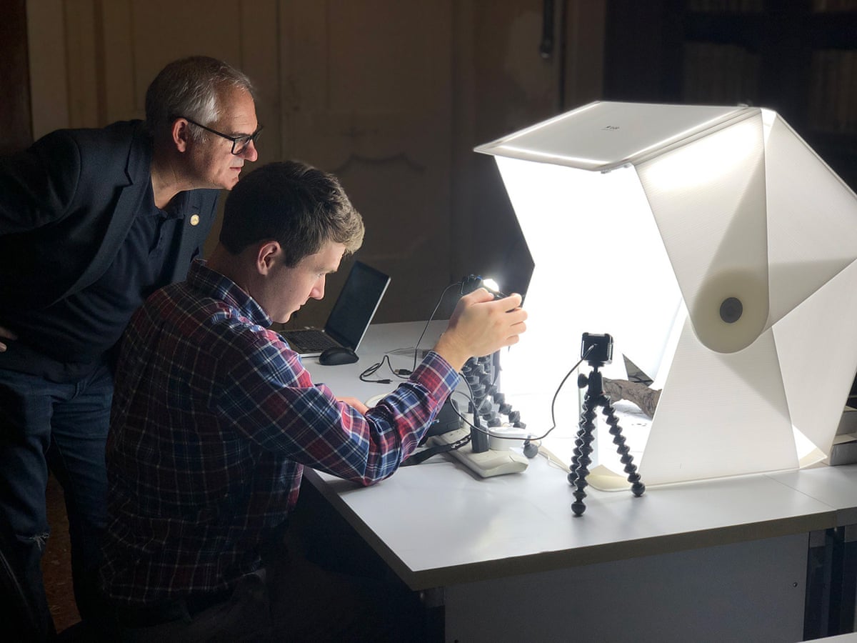 Prof Brent Seales, left, and a member of his team scan the Herculaneum scroll.