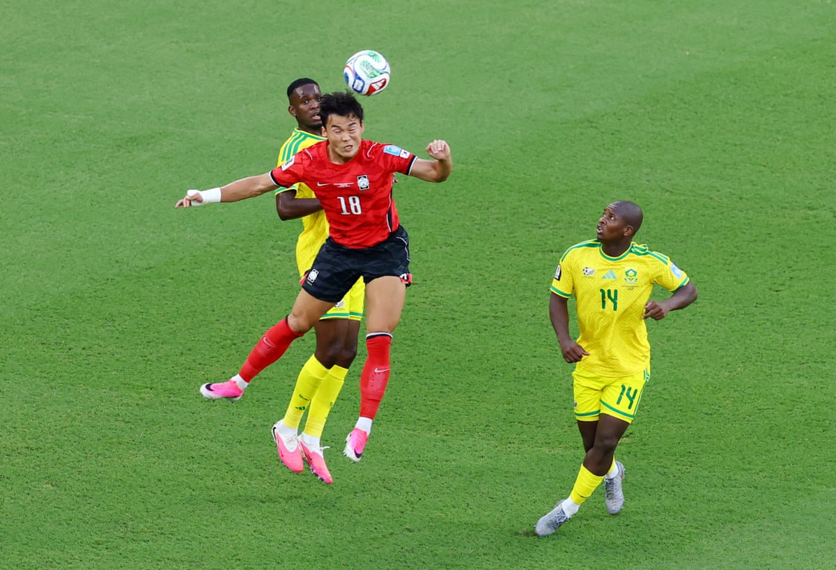 South Korea's Oh Hyeon-gyu goes up for a header with South Africa's Mbekezeli Mbokazi.