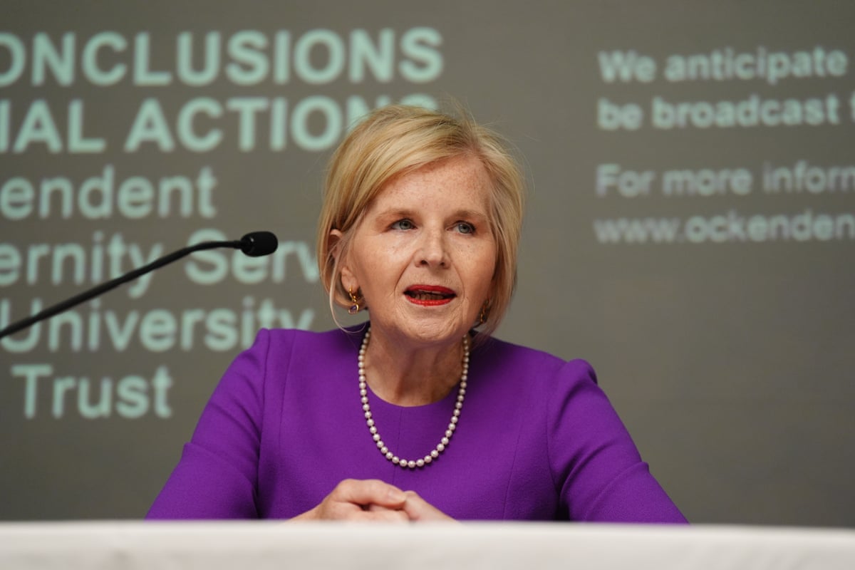 Midwife Donna Ockenden behind a desk at a press conference