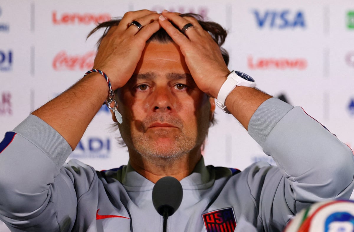 Mauricio Pochettino at a press conference pushing back his air with both hands