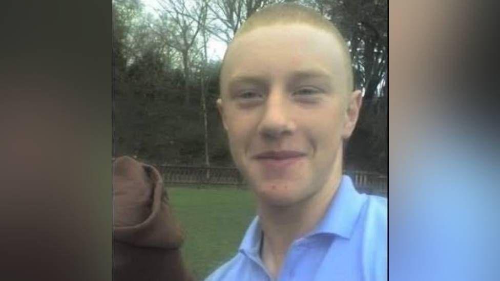 Reuben Morgan, who has short hair and is wearing a blue polo shirt