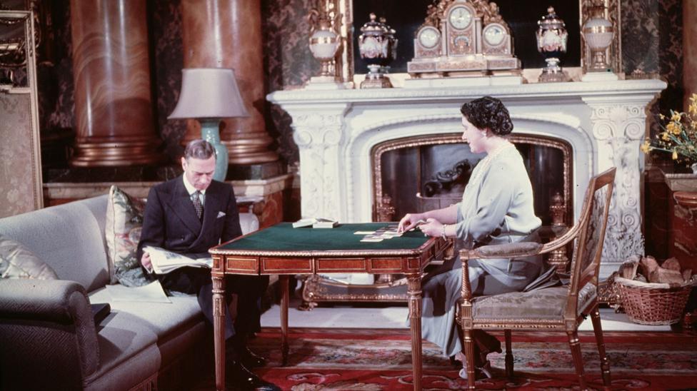King George VI and Queen Elizabeth entertain themselves during a quiet moment at Buckingham Palace, London, in 1942