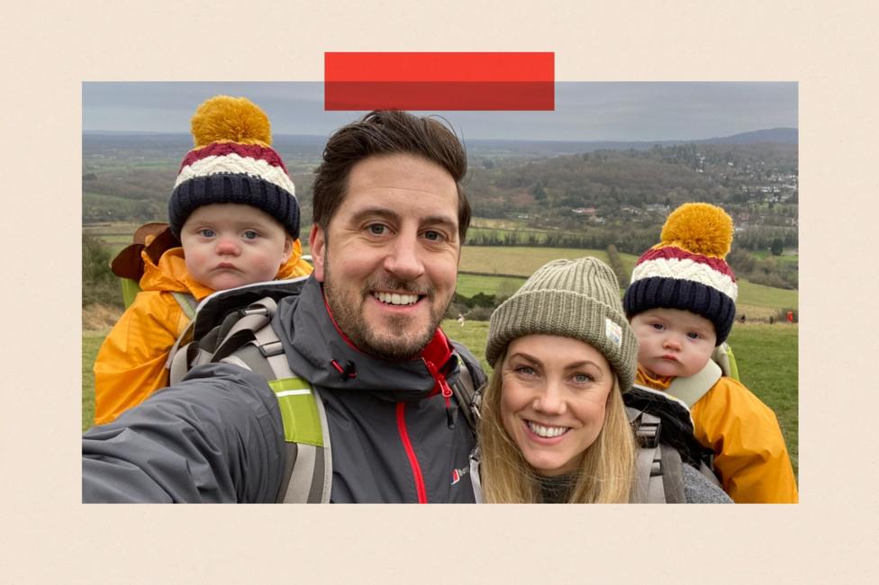 Shaun walking with his partner and two small children in matching bobble hats