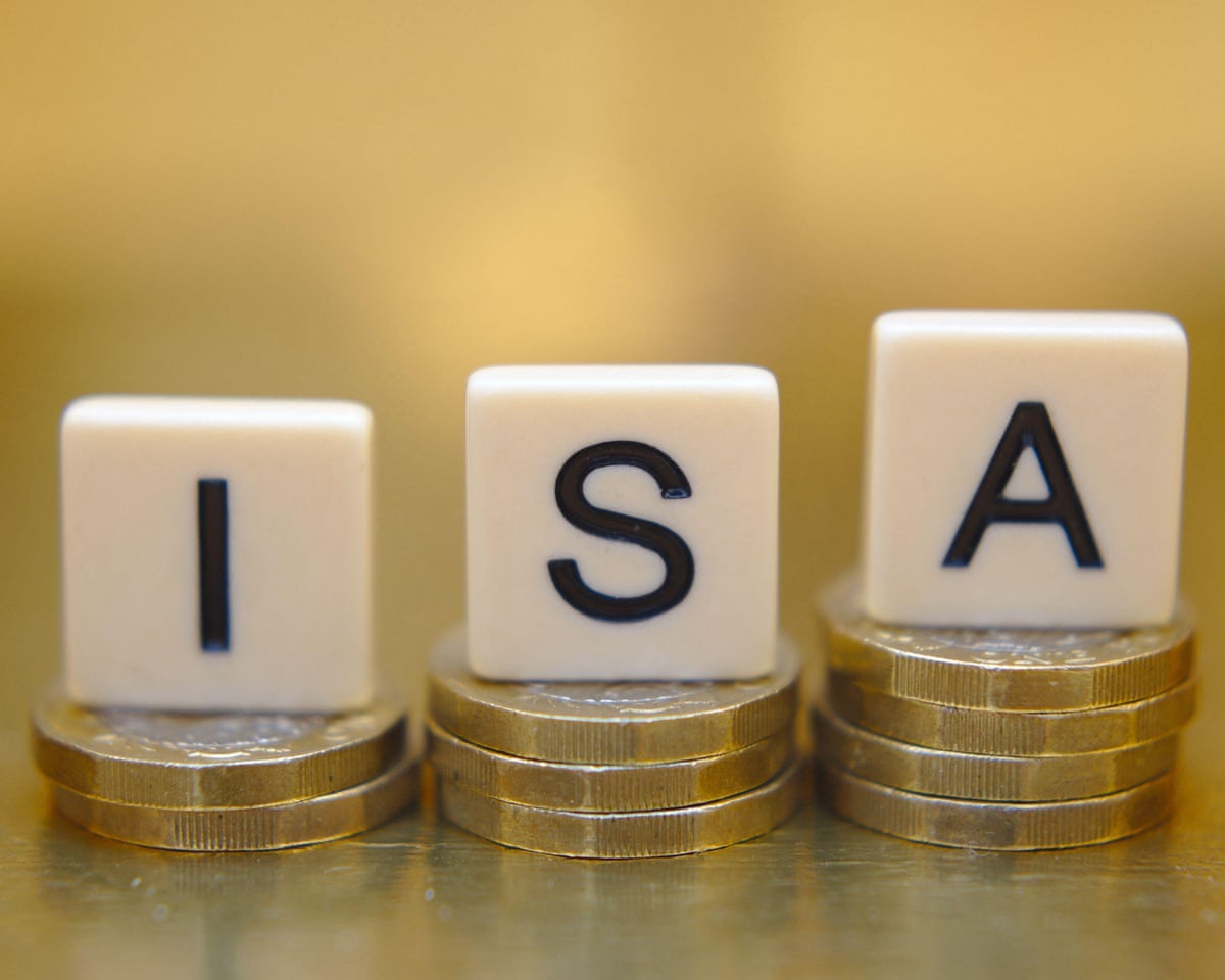 Scrabble-type tiles spelling out Isa on top of pound coins